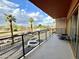 Outdoor balcony with metal guard rail offering city views with several palm trees at 4750 N Central Ave # M2, Phoenix, AZ 85012