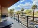 Outdoor balcony with metal guard rail offering city views with several palm trees at 4750 N Central Ave # M2, Phoenix, AZ 85012