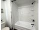 Bathroom featuring a bathtub with tile-look surround and a black shower head at 4750 N Central Ave # M2, Phoenix, AZ 85012