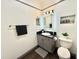 Bathroom featuring a modern vanity with a backlit mirror and stylish decor at 4750 N Central Ave # M2, Phoenix, AZ 85012