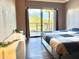 Bedroom with a sliding glass door showcasing a view of the outdoors at 4750 N Central Ave # M2, Phoenix, AZ 85012