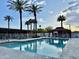 Beautiful community pool with lounge chairs, gazebo, and palm trees at 4750 N Central Ave # M2, Phoenix, AZ 85012