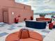 Stylish rooftop deck with comfortable seating, fire pit, and scenic city views at 4750 N Central Ave # M2, Phoenix, AZ 85012