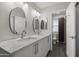 Bright bathroom features a dual sink vanity with marble countertop and modern fixtures at 4904 E Tierra Buena Ln, Scottsdale, AZ 85254