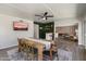 Open-concept dining area with backyard views, shiplap and an adjacent sitting area, ideal for entertaining at 4904 E Tierra Buena Ln, Scottsdale, AZ 85254