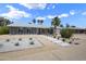Charming single-story home featuring desert landscaping with a rock lawn, walkway, and large cactus at 4904 E Tierra Buena Ln, Scottsdale, AZ 85254