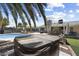 Backyard featuring a spa, a patio, a pool, landscaping and a backdrop of blue skies and palm trees at 4904 E Tierra Buena Ln, Scottsdale, AZ 85254