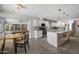Spacious kitchen with granite countertops, white cabinetry, stainless steel appliances, and eat-in dining at 4904 E Tierra Buena Ln, Scottsdale, AZ 85254