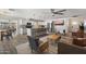 Open-concept living room flows into kitchen, features modern furnishings, and a large island with bar seating at 4904 E Tierra Buena Ln, Scottsdale, AZ 85254
