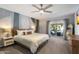 Comfortable bedroom with sliding glass door that leads to a patio sitting area with fire pit at 4904 E Tierra Buena Ln, Scottsdale, AZ 85254