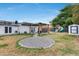 Spacious backyard with lush grass, patio area, and fun playground, creating an ideal outdoor retreat at 5228 W Aster Dr, Glendale, AZ 85304