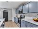 Updated kitchen with white subway tile backsplash, stainless steel appliances and shaker cabinets at 5228 W Aster Dr, Glendale, AZ 85304