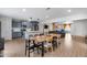 Open-concept kitchen and dining area with updated cabinets, countertops, and stainless steel appliances at 5228 W Aster Dr, Glendale, AZ 85304