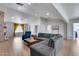Spacious living room with a fireplace, sectional sofa, and lots of natural light at 5228 W Aster Dr, Glendale, AZ 85304