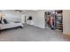 Spacious main bedroom features plush carpeting, a ceiling fan, and a closet at 5228 W Aster Dr, Glendale, AZ 85304
