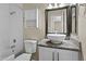 Full bathroom featuring a tub-shower combo, granite countertop vanity, and framed mirror, offering a functional space at 6007 N 79Th St, Scottsdale, AZ 85250