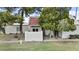 Charming single-story home with a well-maintained lawn, mature trees, and an inviting covered entrance at 6007 N 79Th St, Scottsdale, AZ 85250