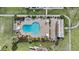 Aerial shot of the community pool, adorned with sun umbrellas, lounge chairs and native plants at 6007 N 79Th St, Scottsdale, AZ 85250