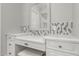 Bathroom featuring a vanity with a white countertop, decorative backsplash, and ample storage space at 6125 E Hodges St, Cave Creek, AZ 85331