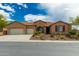 Charming single-story home featuring a well-manicured front yard and an attached two-car garage at 6125 E Hodges St, Cave Creek, AZ 85331