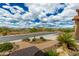 Manicured front yard featuring desert landscaping and a charming stone path to the property at 6125 E Hodges St, Cave Creek, AZ 85331