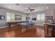 Entertaining game room featuring a ping pong table, shuffleboard, and custom bar, ideal for hosting friends and Gathering at 6125 E Hodges St, Cave Creek, AZ 85331