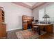 Dedicated home office space with a large desk, built-in storage, and a neutral color palette at 6125 E Hodges St, Cave Creek, AZ 85331