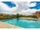 Sparkling pool and patio offer a private oasis with mature desert landscaping and great views at 6125 E Hodges St, Cave Creek, AZ 85331