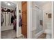 Bathroom featuring a glass-enclosed shower, toilet and a walk-in closet at 6441 E Colby St, Mesa, AZ 85205