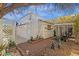 Secluded courtyard featuring a covered patio, tiled walkway, decorative plants, and elegant lighting fixtures at 6441 E Colby St, Mesa, AZ 85205