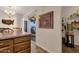 Dining area with slider to outdoor patio, vintage-style light fixture and tile floors at 6441 E Colby St, Mesa, AZ 85205