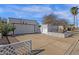 Charming single-story home features mature landscaping, desert plants, and a well-maintained driveway, with a lattice fence at 6441 E Colby St, Mesa, AZ 85205