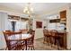 Eat-in kitchen area with access to the outdoor patio through sliding glass doors at 6441 E Colby St, Mesa, AZ 85205