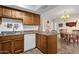 Kitchen with light wood cabinets, a stainless steel sink, and eat-in kitchen table at 6441 E Colby St, Mesa, AZ 85205