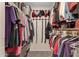 Well-organized walk-in closet with double hanging rods, shelving and ample storage space at 6441 E Colby St, Mesa, AZ 85205