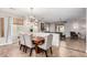 Elegant dining room with stylish chandelier and views into the living room at 6608 W Saguaro Park Ln, Glendale, AZ 85310