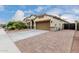 This charming house includes an attached two-car garage and well-manicured landscaping at 6608 W Saguaro Park Ln, Glendale, AZ 85310