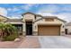 Charming single-Gathering home with beautiful desert landscaping and a two-car garage at 6608 W Saguaro Park Ln, Glendale, AZ 85310