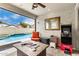 This covered patio features an outdoor seating area and easy access to the pool at 6608 W Saguaro Park Ln, Glendale, AZ 85310