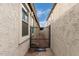 Gated side yard for pets and/or additional outdoor storage at 6608 W Saguaro Park Ln, Glendale, AZ 85310