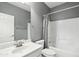 Clean bathroom featuring a single vanity, toilet, and shower-tub with updated fixtures at 6777 W Tether Trl, Peoria, AZ 85383