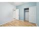Bedroom with neutral walls, ceiling fan, wood floors and closet at 6777 W Tether Trl, Peoria, AZ 85383