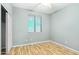Bedroom with a window, wood floors, ceiling fan and closet at 6777 W Tether Trl, Peoria, AZ 85383