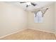 Neutral bedroom with wood floors, ceiling fan, and window with blinds at 6777 W Tether Trl, Peoria, AZ 85383