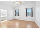 Spacious main bedroom with vaulted ceiling, wood floors, windows and ensuite bathroom at 6777 W Tether Trl, Peoria, AZ 85383