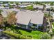 Aerial view of a backyard featuring a covered patio and lush green grass at 6920 W Via Montoya Dr, Glendale, AZ 85310