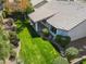 Aerial view of a well-maintained backyard and covered patio area at 6920 W Via Montoya Dr, Glendale, AZ 85310