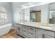 Updated bathroom featuring double vanity, soaking tub, and walk-in shower at 6920 W Via Montoya Dr, Glendale, AZ 85310