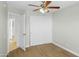 Bedroom with sliding closet doors, door to the hallway, and neutral walls at 6920 W Via Montoya Dr, Glendale, AZ 85310