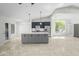 Spacious open-concept kitchen with quartz countertops and stainless steel appliances at 6920 W Via Montoya Dr, Glendale, AZ 85310